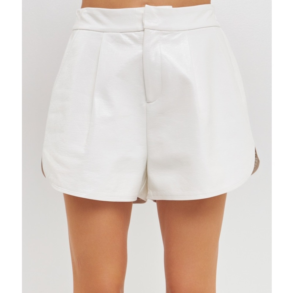 Off-white vegan leather shorts.